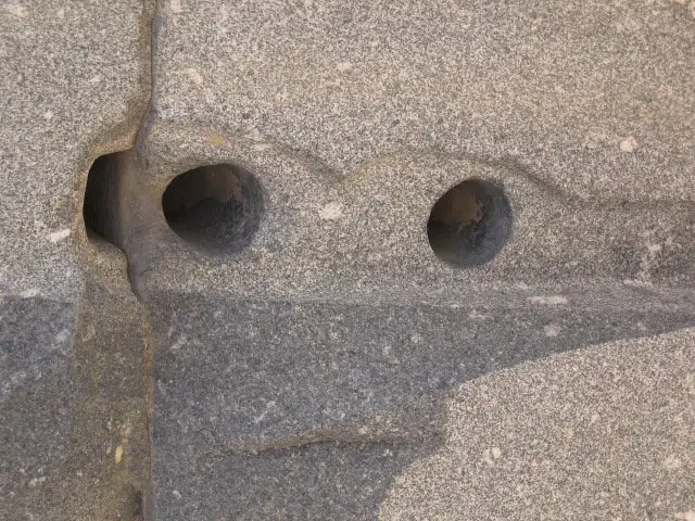 Close-up of holes drilled in granite. Image Credit