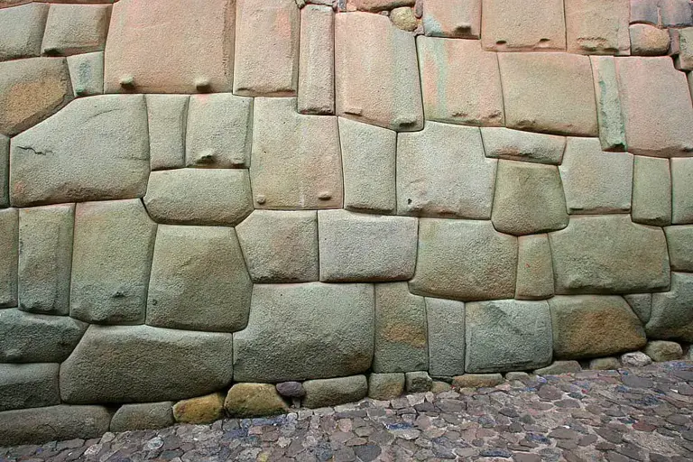 Incan stonework, Palace of Inca Roca, Cuzco, Peru. Another example of extreme precision. Not a single sheet of paper fits between the rocks. Some of theme look as if they were 'fused' together.
