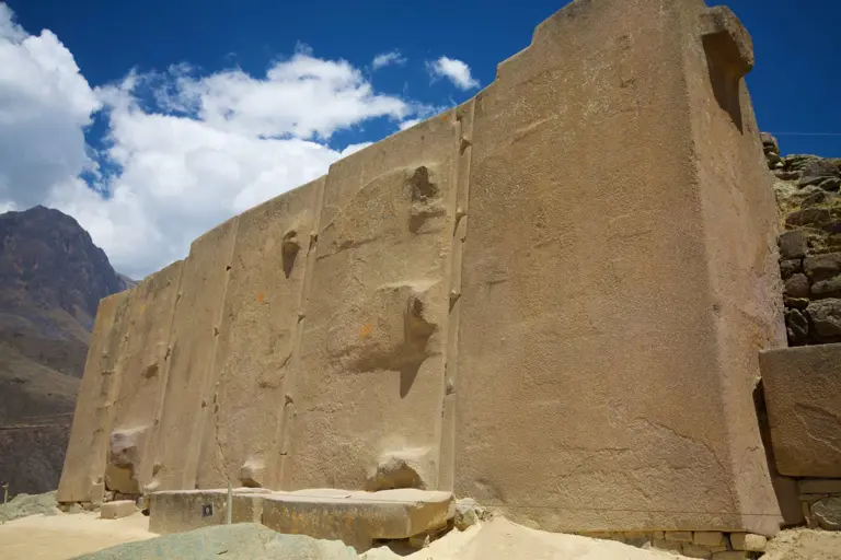 Ollantaytambo: The temple of the Sun. Just how did ancient mankind achieve this? In this image we have the six red-granite monoliths that were to be part of an unfinished circular wall. The monoliths are separated by "spacer rocks" which prevents them from collapsing during seismic events.