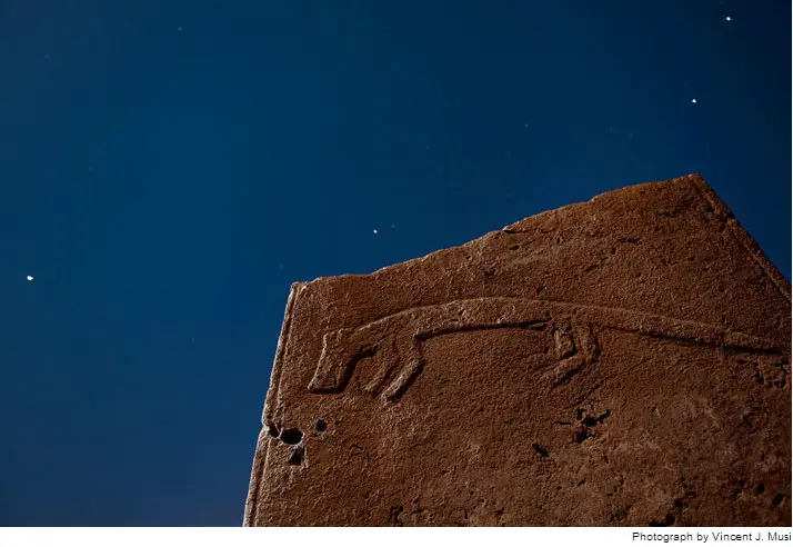 A pillar with a carved, elongated fox stands against the starry night. To protect the fragile reliefs, archaeologists plan to construct a roof over the site this year. Pondering the mysteries of this ancient temple under an open sky will soon be a thing of the past.