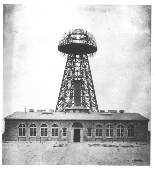 1904 image of Wardenclyffe Tower located in Shoreham, Long Island, New York. The 94 by 94 ft (29 m) brick building was designed by architect Stanford White.