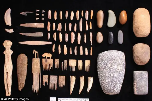 Treasure trove: Archaeologists in southern Egypt found a mummy that predates the First Dynasty and the unification of Egypt together with an array of precious objects (pictured), the Egyptian Antiquities Ministry announced 