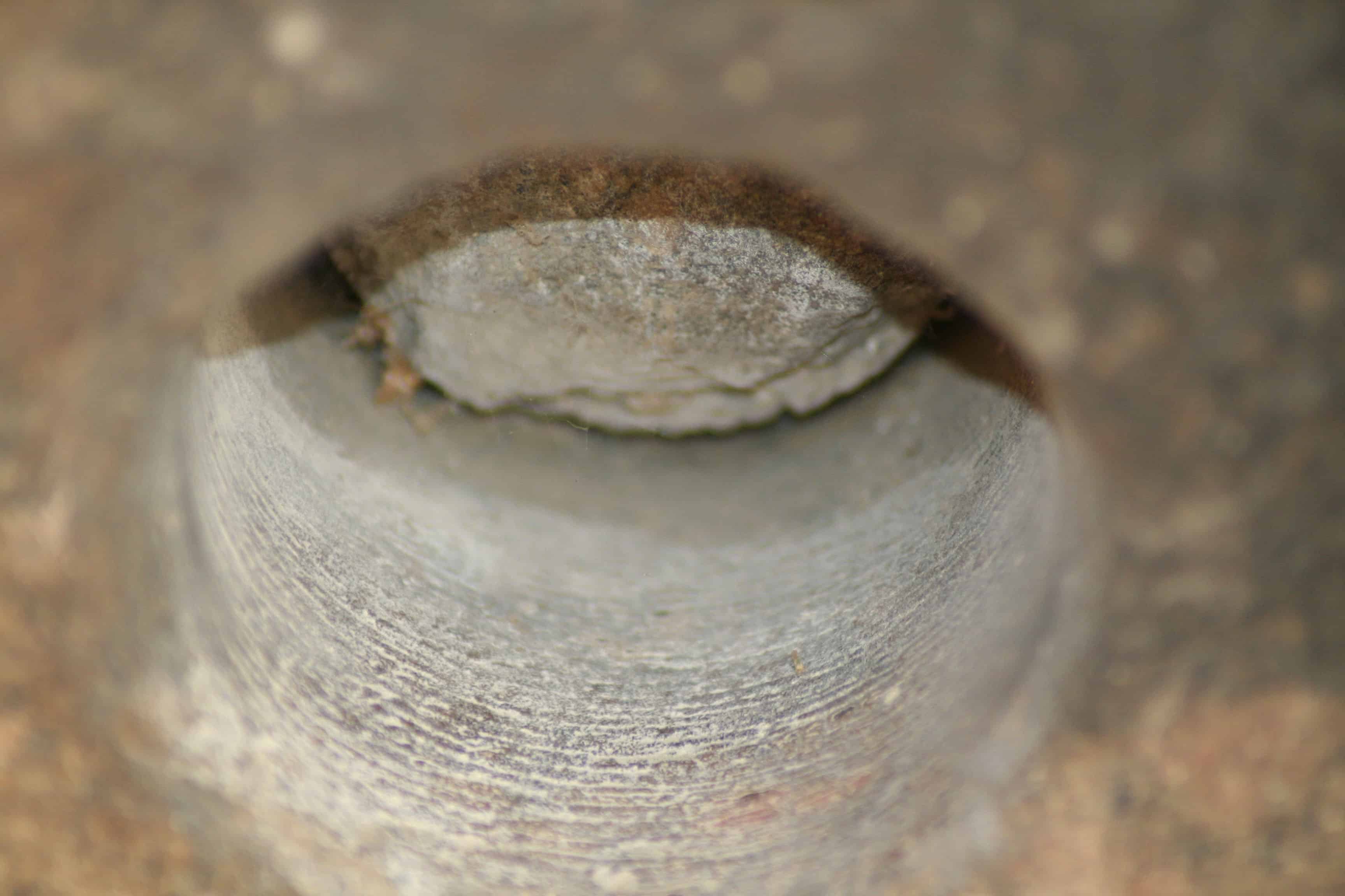 Giza. Close-up of drill hole in granite with spiral grooves. Photo by Chris Dunn. 2007. Image Credit