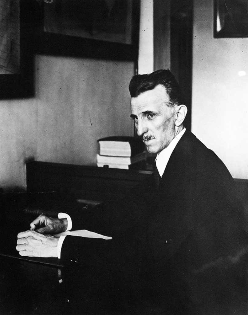 Nikola Tesla photographed working in his office at 8 West 40th Street. The image was taken in 1916.