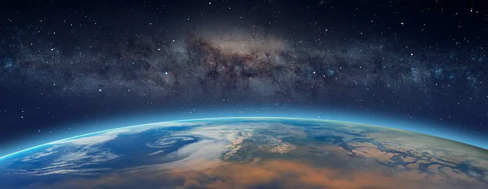 Planet Earth in front of the Milky Way galaxy Elements of this image furnished by NASA